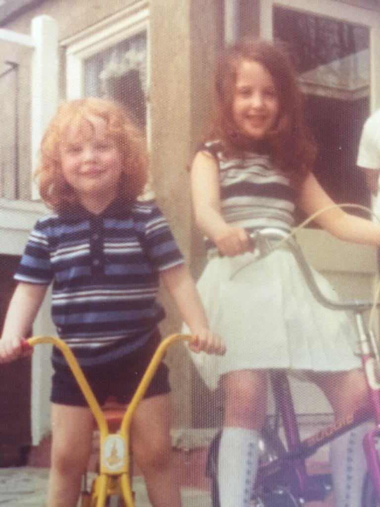Michael Galloway as a child on his bike with sister